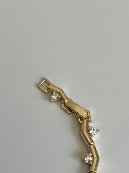 Gold Rengi Yuvarlak Zirkon Taş Detaylı Çivi Model Kadın Bileklik