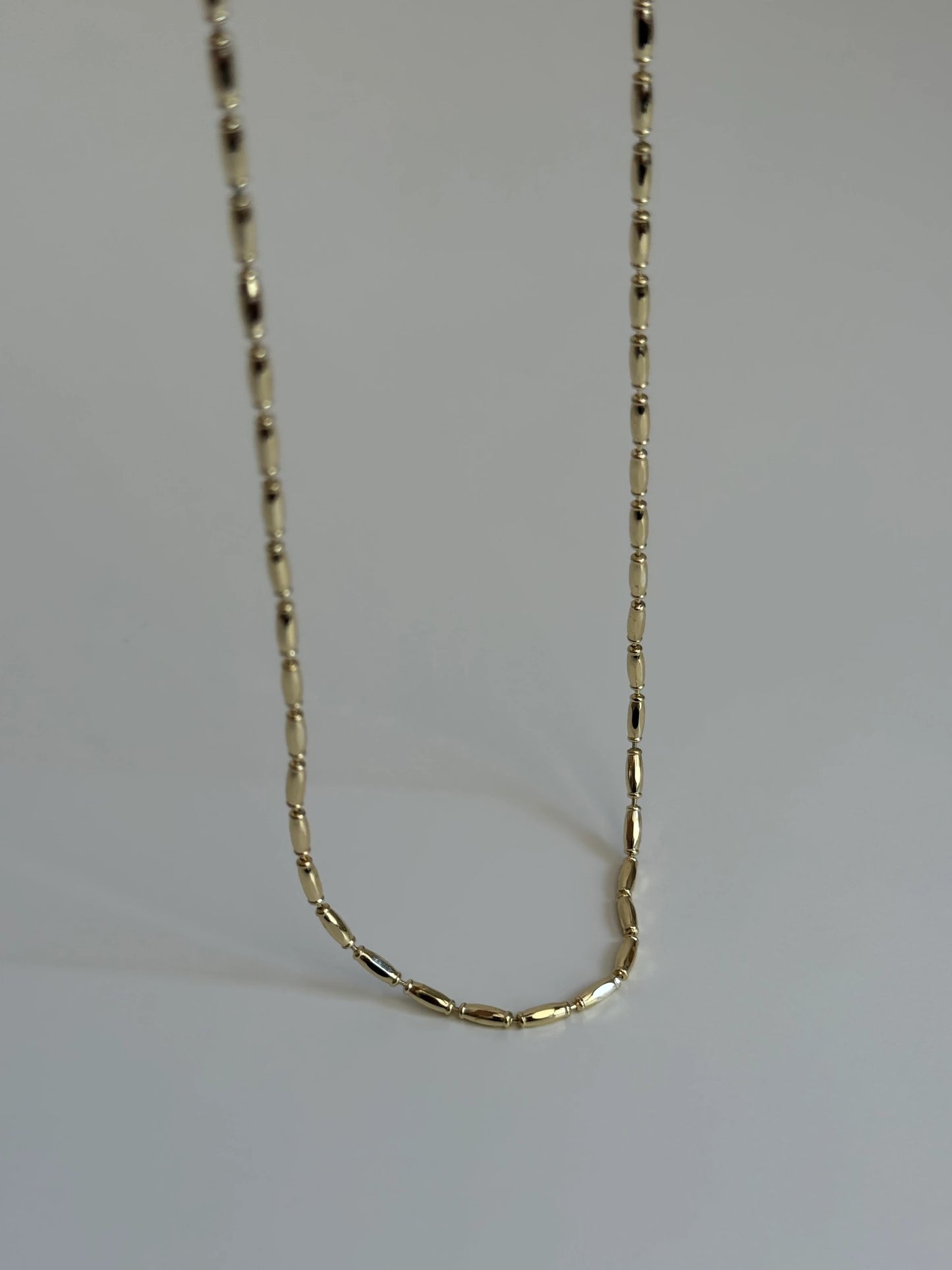 Gold Rengi Bombeli Şerit Model Kadın Kolye