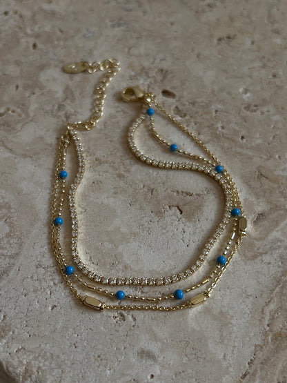 Gold Rengi Zirkon Taşlı Mavi Top Detaylı Üç Sıra Kadın Bileklik